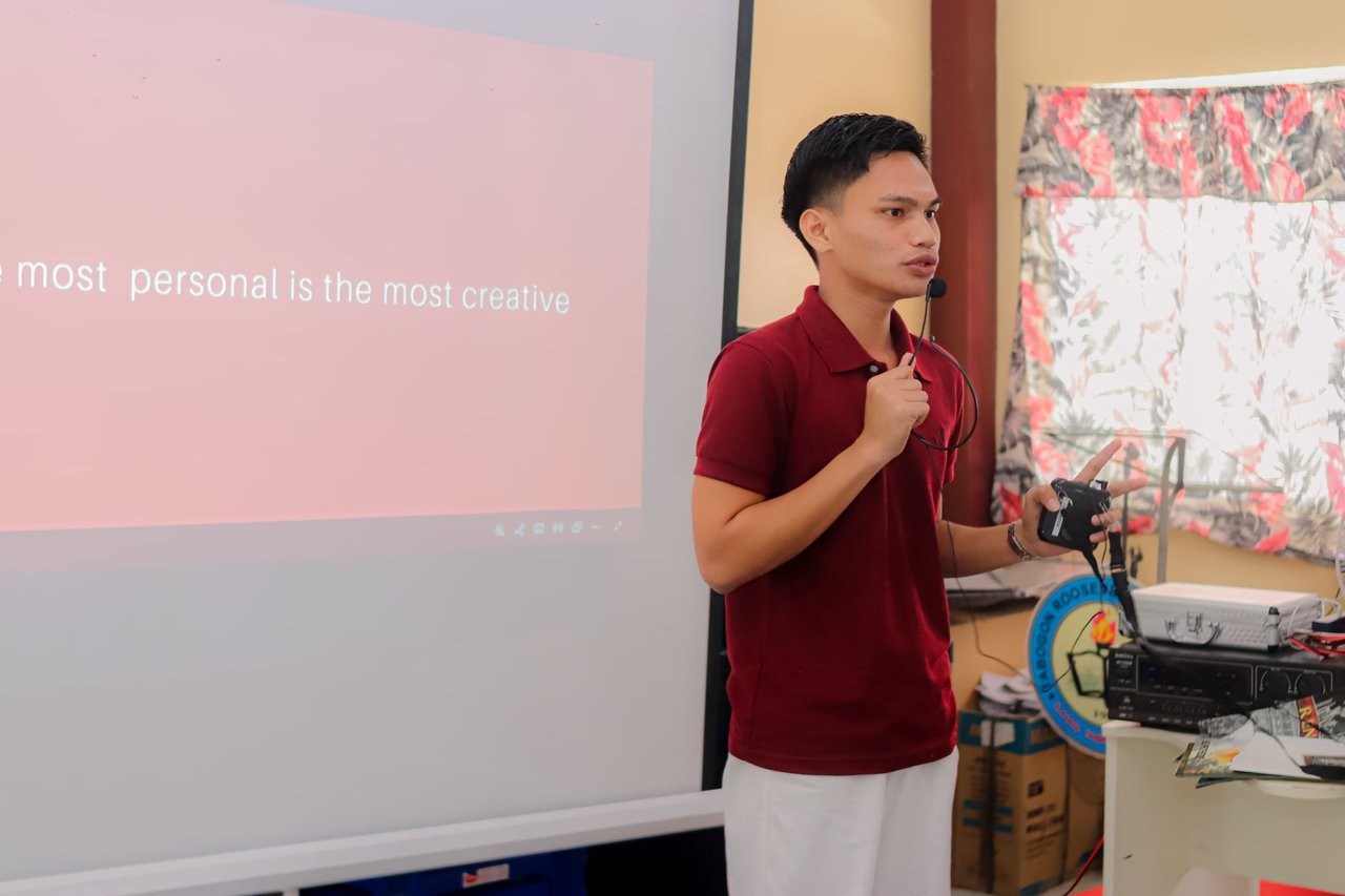 Jose Ar Den P. Villafuente speaking at a campus session